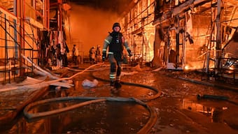 krainian firefighters struggle to extinguish a fire ravaging the Barabashovo market following an airstrike in Kharkiv on October 1, 2025 amid the Russian invasion of Ukraine.- AFP