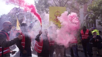 Unionists use flares during a new round of strikes and protests against the caretaker government and cost-cutting Thursday, Oct. 2, 2025 in Paris. (AP Photo)