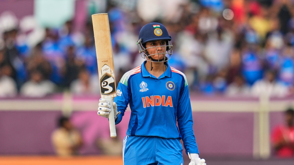 India opener Smriti Mandhana raises her bat after completing her half-century in the ICC Women's World Cup match against Australia in Visakhapatnam. AP India opener Smriti Mandhana raises her bat after completing her half-century in the ICC Women's World Cup match against Australia in Visakhapatnam. AP