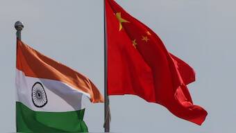 National flags of China and India fly next to the Meijiang Convention and Exhibition Center, a venue for 2025 Shanghai Cooperation Organisation (SCO) summit in Tianjin, China August 30, 2025