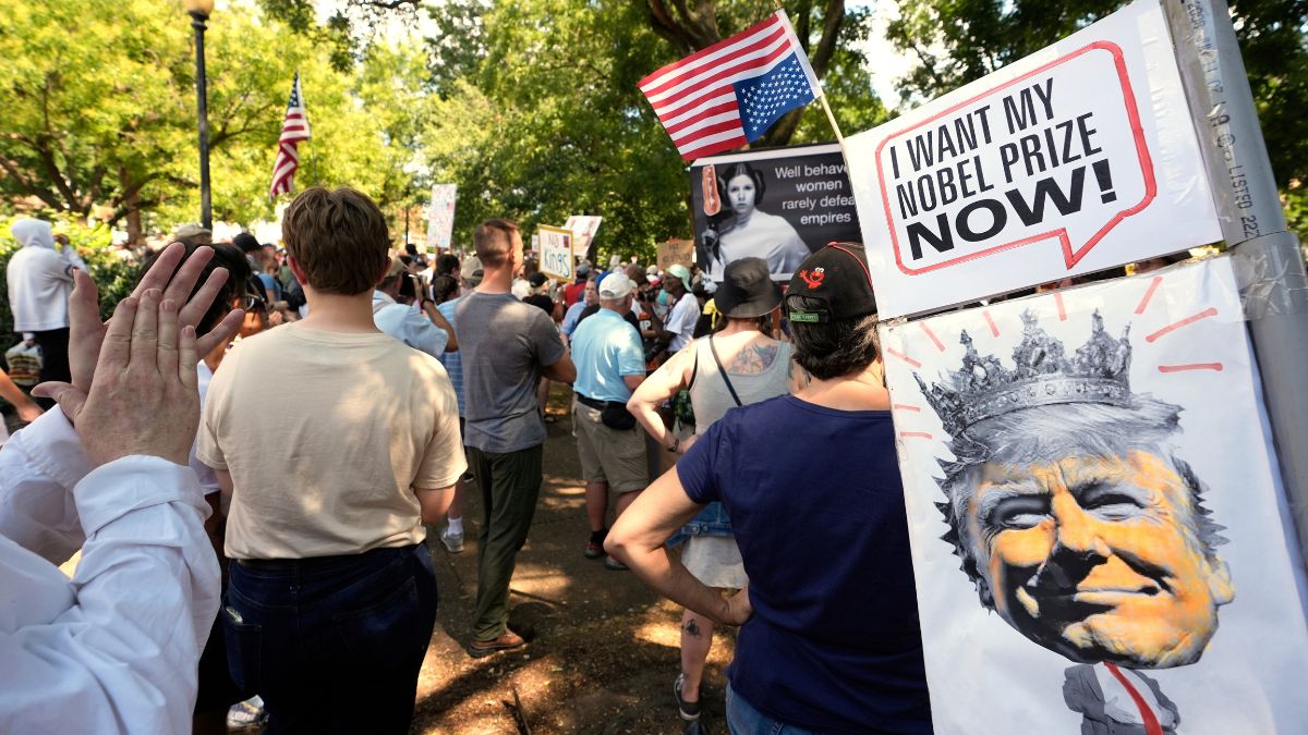 Activists carry signs during a protest against President Donald Trump's federal takeover of policing of the District of Columbia, August 16, 2025, in Washington, DC, US. File Image/AP Activists carry signs during a protest against President Donald Trump's federal takeover of policing of the District of Columbia, August 16, 2025, in Washington, DC, US. File Image/AP