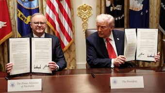 US President Donald Trump and Australia's Prime Minister Anthony Albanese hold a signed agreement on rare earth and critical minerals during a meeting with in the Cabinet Room at the White House, in Washington, DC, US, October 20, 2025. File Image/Reuters