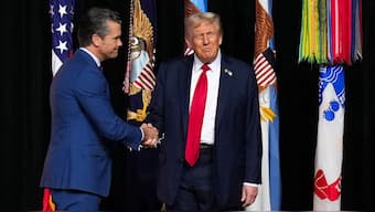 US President Donald Trump greets US Defence Secretary Pete Hegseth as he arrives to speak to senior military leaders at Marine Corps Base Quantico, in Quantico, Virginia, September 30, 2025. File Image/Pool via Reuters