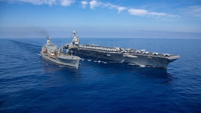 The world's largest aircraft carrier USS Gerald R Ford steams alongside USNS Laramie (T-AO-203) during a fuelling-at-sea in the eastern Mediterranean Sea. File Image