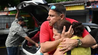 Salvadoran journalist Mario Guevara embraces a relative after his deportation from the US following three months in federal custody, in Olocuilta, El Salvador. (Image credit: AFP)