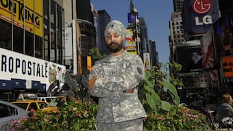 US Army Captain Kamaljeet Singh Kalsi poses in Times Square, New York, on September 14, 2010 , wearing his US Army ACU Digital Camouflage turban along with his ACU uniform. File Photo/AFP