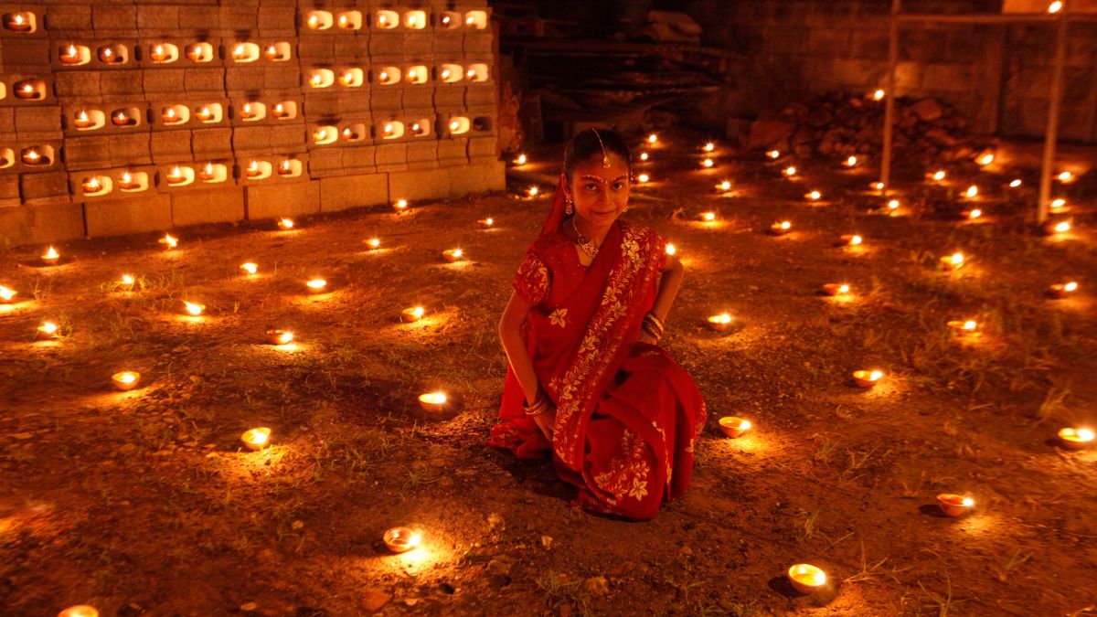 A girl sits among diyas, or oil lamps, in her yard during Diwali celebrations in Felicity, central Trinidad November 13, 2012. File Photo/Reuters A girl sits among diyas, or oil lamps, in her yard during Diwali celebrations in Felicity, central Trinidad November 13, 2012. File Photo/Reuters