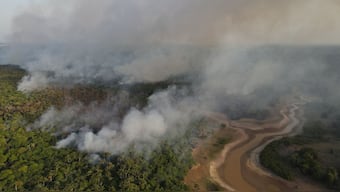 Smoke billows from a wildfire in the Amazon rainforest near a dry river in Iranduba, Amazon. File image/Reuters