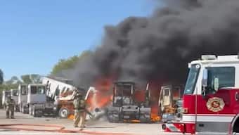 Firefighters work to battle the flames from a plane crash near Hicks Airfield in Tarrant County, Texas. X