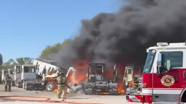 2 killed as plane crashes into trailers near Texas airfield, nearby building catches fire