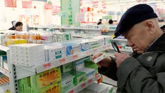 An elderly man uses a magnifier to see the descriptions on a pack of medicine at a pharmacy in Dandong, Liaoning province, China, March 30, 2011. Representational Image/Reuters
