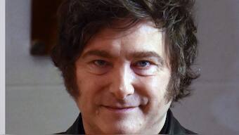 Argentina's President Javier Milei poses for a picture before voting at a polling station during the national midterm legislative elections in Buenos Aires on October 26, 2025. (AFP)