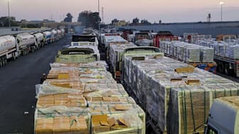 Trucks carrying humanitarian aid and fuel line up at the crossing into the Gaza Strip at the Rafah border on the Egypt side, amid a ceasefire between Israel and Hamas in Gaza, in Rafah, Egypt, October 17. REUTERS file

