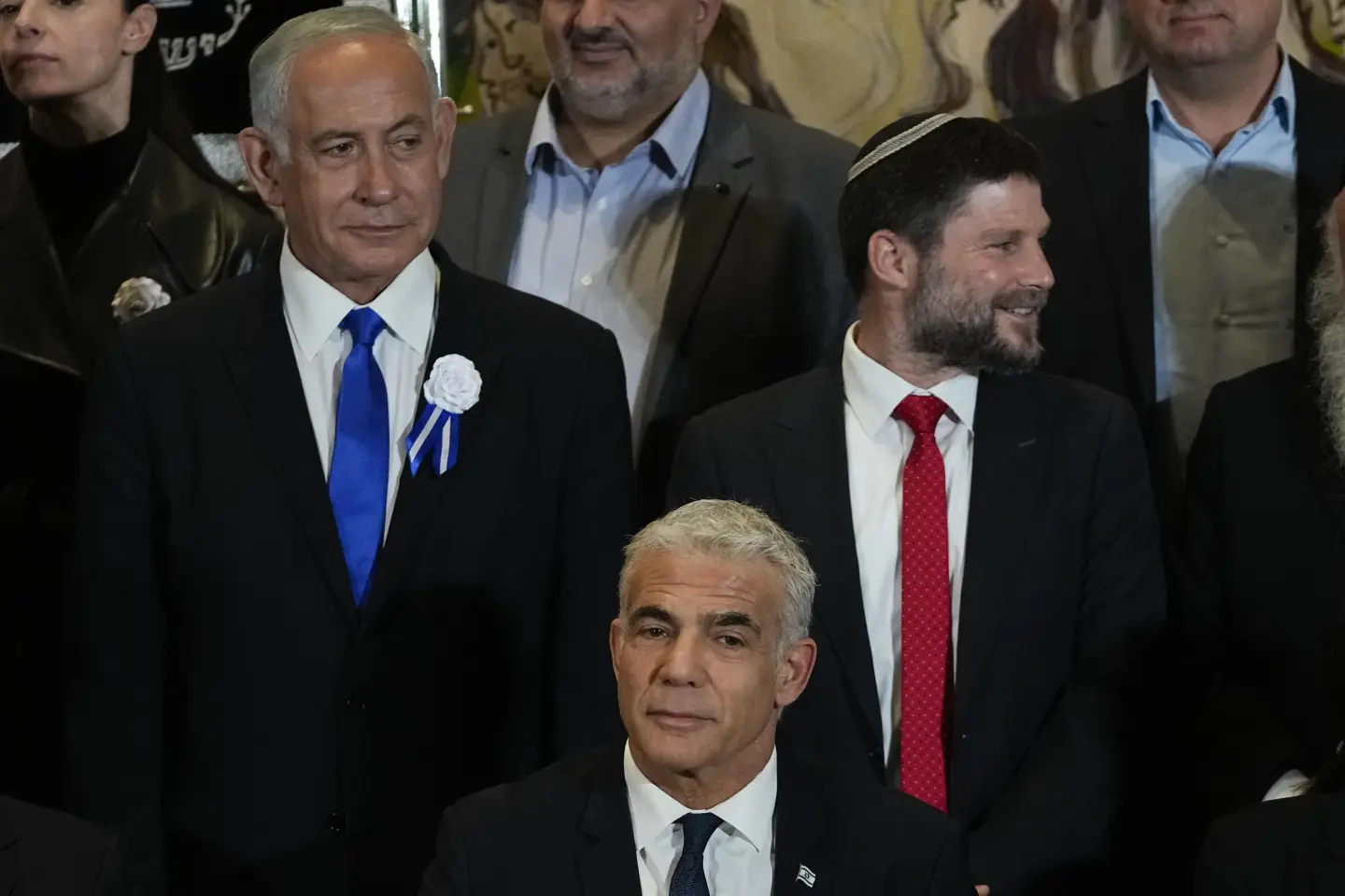 general general FILE-Israeli Prime Minister Yair Lapid, center, Likud Party leader Benjamin Netanyahu, left, far-right Israeli lawmaker Bezalel Smotrich and leaders of all Israel’s political parties pose for a group photo after the swearing-in ceremony for Israeli lawmakers at the Knesset, Israel’s parliament, in Jerusalem, Tuesday, Nov. 15, 2022. AP