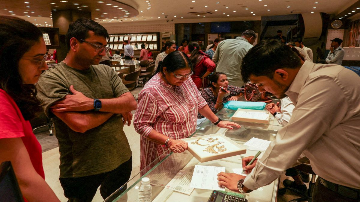 A salesperson calculates the weight of a gold necklace for customers at a jewellery showroom in Ahmedabad, India. Every year, there's a gold rush during Diwali. File image/Reuters A salesperson calculates the weight of a gold necklace for customers at a jewellery showroom in Ahmedabad, India. Every year, there's a gold rush during Diwali. File image/Reuters