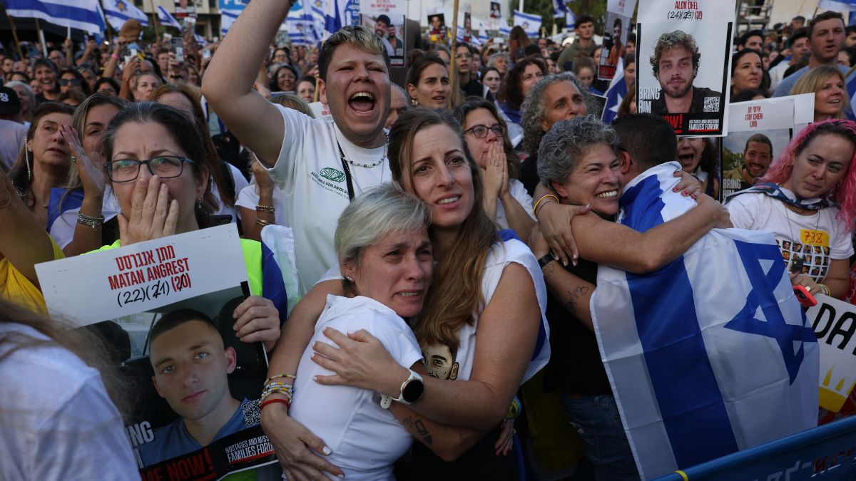 Israelis react as they wait for the release of Israelis still held in Gaza at Hostage Square in Tel Aviv early on October 13, 2025. AFP Israelis react as they wait for the release of Israelis still held in Gaza at Hostage Square in Tel Aviv early on October 13, 2025. AFP