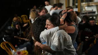 Relatives and supporters of Israeli hostages held by Hamas in the Gaza Strip celebrate after the announcement that Israel and Hamas have agreed to the first phase of a plan releasing the hostages and ending war in Gaza, in Hostages Square in Tel Aviv, Israel, Thursday, Oct. 9, 2025. AP
