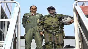 President Droupadi Murmu poses for pictures before she takes a sortie in Rafale fighter jet, at Air Force Station in Haryana's Ambala. Posing with her is IAF's Squadron Leader Shivangi Singh. 
Rashtrapati Bhavan/PTI