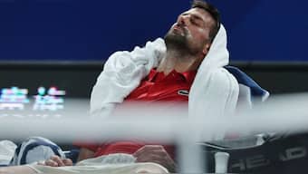 Novak Djokovic rests during a break in his round of 16 match against Spain's Jaume Munar. Image: Reuters