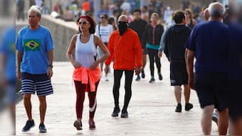 People walk on the promenade of Las Canteras beach on the island of Gran Canaria, Spain, May 2, 2020. Representational Image/Reuters