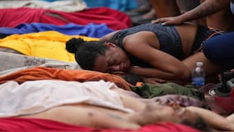 A woman mourns over the bodies of people killed the day before during a police raid targeting the Comando Vermelho gang in the Complexo da Penha favela of Rio de Janeiro, Brazil. AP