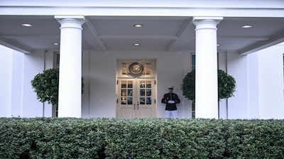 A US Marine stands guard outside the West Wing of the White House in Washington, DC. AFP