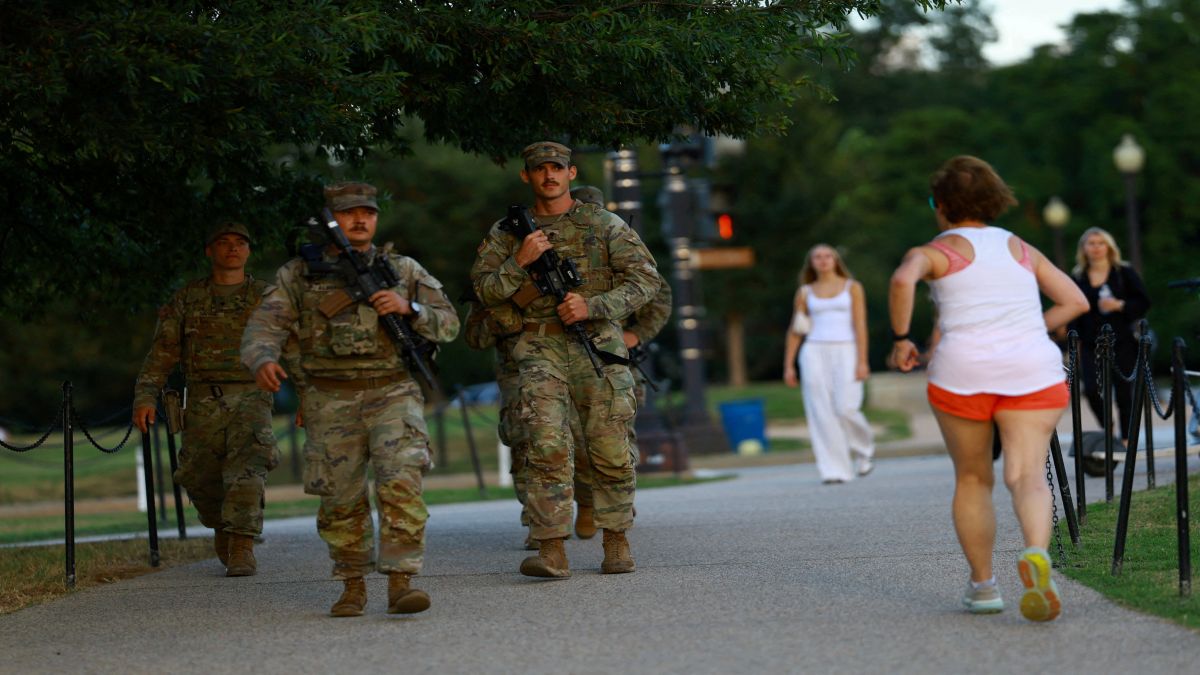 Members of the National Guard carry firearms while patrolling the National Mall, weeks after US President Donald Trump ordered the National Guard and law enforcement to patrol the nation's capital to assist in crime prevention, in Washington. On Monday, US President Trump threatened to invoke the Insurrection Act in response to recent court rulings that have blocked his efforts to deploy the National Guard in major American cities. File image/Reuters Members of the National Guard carry firearms while patrolling the National Mall, weeks after US President Donald Trump ordered the National Guard and law enforcement to patrol the nation's capital to assist in crime prevention, in Washington. On Monday, US President Trump threatened to invoke the Insurrection Act in response to recent court rulings that have blocked his efforts to deploy the National Guard in major American cities. File image/Reuters