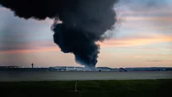  A plume of smoke rises from the site of a UPS cargo plane crash at Louisville Muhammad Ali International Airport on November 4, 2025, in Louisville, Kentucky. AP