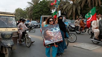 Supporters of Pakistan's former Prime Minister Imran Khan and his party, Pakistan Tehreek-e-Insaf (PTI), take part in a nationwide protest demanding Khan's release on the second anniversary of his jailing, in Karachi, Pakistan, August 5, 2025. File Photo/Reuters