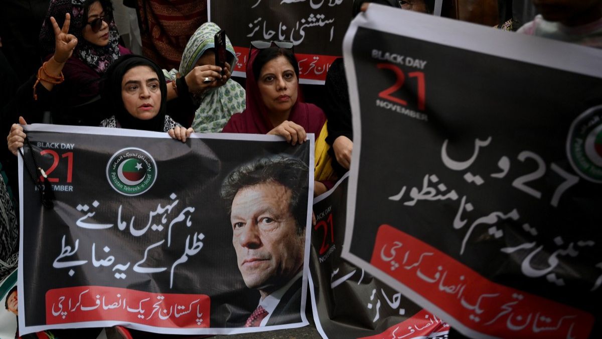 Pakistan Tehreek-e-Insaf (PTI) party supporters carry a poster of their leader and former Prime Minister Imran Khan, during a protest against the 27th constitutional amendment, in Karachi on November 21, 2025. File Photo/AFP Pakistan Tehreek-e-Insaf (PTI) party supporters carry a poster of their leader and former Prime Minister Imran Khan, during a protest against the 27th constitutional amendment, in Karachi on November 21, 2025. File Photo/AFP