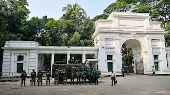 Border Guard Bangladesh (BGB) personnel stand guard outside the High Court in Dhaka on November 12, 2025. AFP
