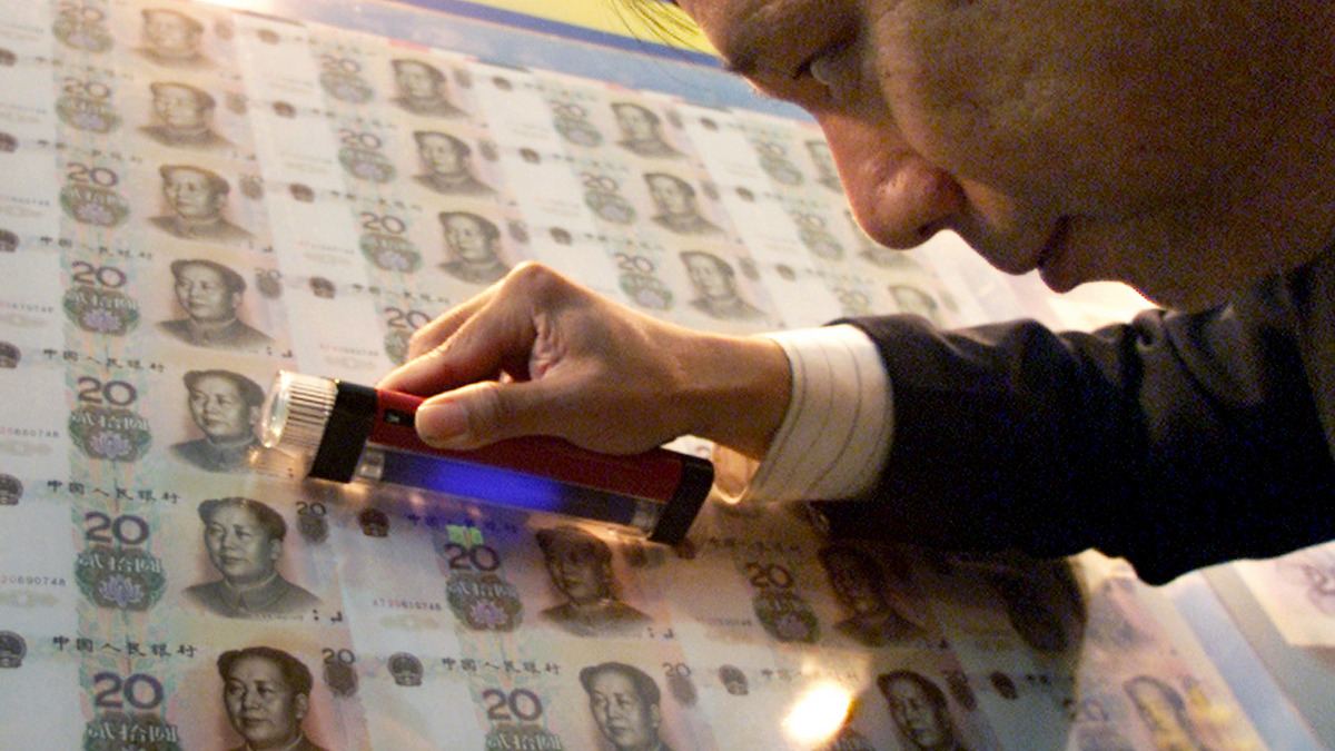 An expert from the Beijing Banknote Printing and Minting Corporation inspects the new 20 yuan notes during the first international anti-counterfeiting exhibition in Beijing,. Reuters An expert from the Beijing Banknote Printing and Minting Corporation inspects the new 20 yuan notes during the first international anti-counterfeiting exhibition in Beijing,. Reuters