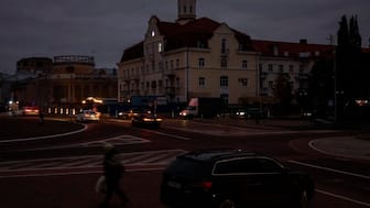 Vehicles drive through the city centre during a power outage after critical infrastructure was hit in a Russian drone attack in Chernihiv, Ukraine, on October 21. REUTERS file