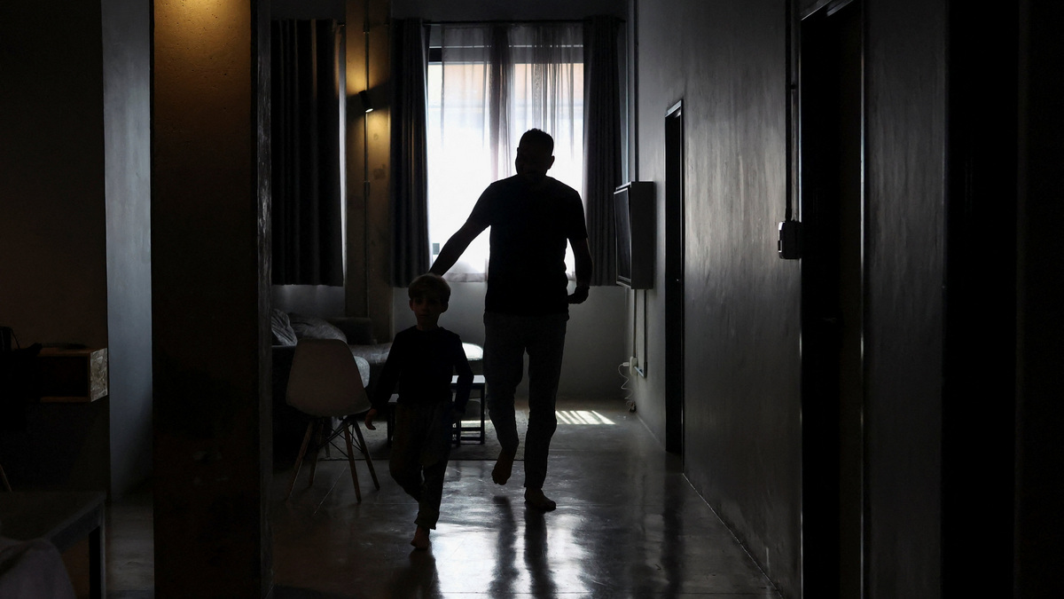 A Palestinian man, one of 130 granted entry to South Africa after initially being denied for not meeting immigration requirements, walks with his child at an undisclosed location in Johannesburg, South Africa. Reuters A Palestinian man, one of 130 granted entry to South Africa after initially being denied for not meeting immigration requirements, walks with his child at an undisclosed location in Johannesburg, South Africa. Reuters