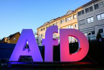 FILE PHOTO: A logo of Germany's far-right Alternative for Germany (AfD) party is illuminated at AfD headquarters during the 2025 general election, in Berlin, Germany, February 23, 2025. REUTERS/Nadja Wohlleben/File Photo