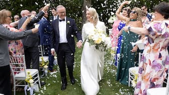 Australian Prime Minister Anthony Albanese and Jodie Haydon walk down the aisle after getting married in Canberra, Australia, November 29, 2025. Mike Bowers for PMO/Handout via REUTERS