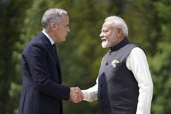 Canadian Prime Minister Mark Carney greets Indian Prime Minister Narendra Modi before a group photo during the Group of Seven (G7) Summit at the Pomeroy Kananaskis Mountain Lodge in Kananaskis, Alberta, Canada on June 17, 2025. (AFP)