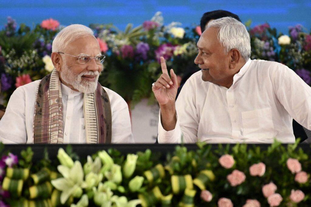 Prime Minister Narendra Modi (L) speaks with Nitish Kumar. AFP