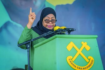 (FILES) Tanzanias ruling party Chama Cha Mapinduzi (CCM) presidential candidate and incumbent President Samia Suluhu Hassan delivers her remarks during the party's closing campaign rally in Mwanza on October 28, 2025. Tanzanian President Samia Suluhu Hassan won a landslide election victory with 97.66 percent of the vote, the electoral commission announced on November 1, 2025, after polls that lacked major opposition candidates and descended into violent protests. (Photo by Michael JAMSON / AFP)