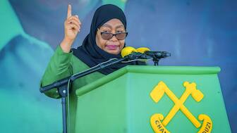 (FILES) Tanzanias ruling party Chama Cha Mapinduzi (CCM) presidential candidate and incumbent President Samia Suluhu Hassan delivers her remarks during the party's closing campaign rally in Mwanza on October 28, 2025. Tanzanian President Samia Suluhu Hassan won a landslide election victory with 97.66 percent of the vote, the electoral commission announced on November 1, 2025, after polls that lacked major opposition candidates and descended into violent protests. (Photo by Michael JAMSON / AFP)