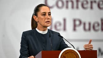 Mexico's President Claudia Sheinbaum speaks during her daily press conference where she announced progress in the organization of the upcoming FIFA 2026 World Cup, at Palacio Nacional in Mexico City on November 3, 2025. (Photo by CARL DE SOUZA / AFP)