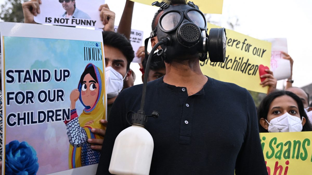 Demonstrators wearing masks hold posters during a protest demanding the government take action to reduce air pollution in New Delhi (AFP) Demonstrators wearing masks hold posters during a protest demanding the government take action to reduce air pollution in New Delhi (AFP)