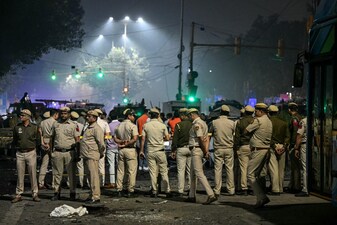 Security personnel gather at the blast site after an explosion near the Red Fort in the old quarters of Delhi on November 10, 2025. AFP File