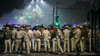 Security personnel gather at the blast site after an explosion near the Red Fort in the old quarters of Delhi on November 10, 2025. AFP File