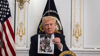President Donald Trump participates in a call with US service members from his Mar-a-Lago club in Florida on Thanksgiving Day on November 27, 2025 in Palm Beach, Florida.   (AFP)