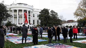 People walk past the AIDS Memorial Quilt on display for the first time on the South Lawn of the White House on the day of an event marking World AIDS Day in Washington, US, December 1, 2024. File Image/Reuters