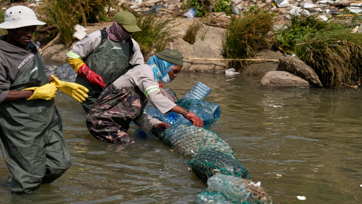 Volunteers wearing wetsuits untangle a long garbage net on the Jukskei River in the Alexandra township in Johannesburg, South Africa, on Nov. 12, 2025. AP Volunteers wearing wetsuits untangle a long garbage net on the Jukskei River in the Alexandra township in Johannesburg, South Africa, on Nov. 12, 2025. AP