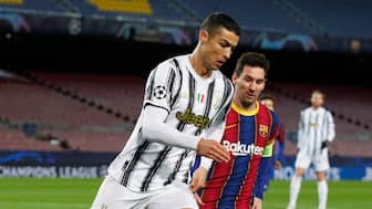 Cristiano Ronaldo and Lionel Messi fight for the ball during the UEFA Champions League showdown between Juventus and Barcelona in December 2020. Reuters