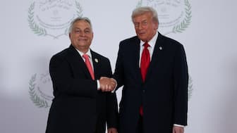 US President Donald Trump and Hungarian Prime Minister Viktor Orban shake hands in Sharm el-Sheikh, Egypt. Reuters