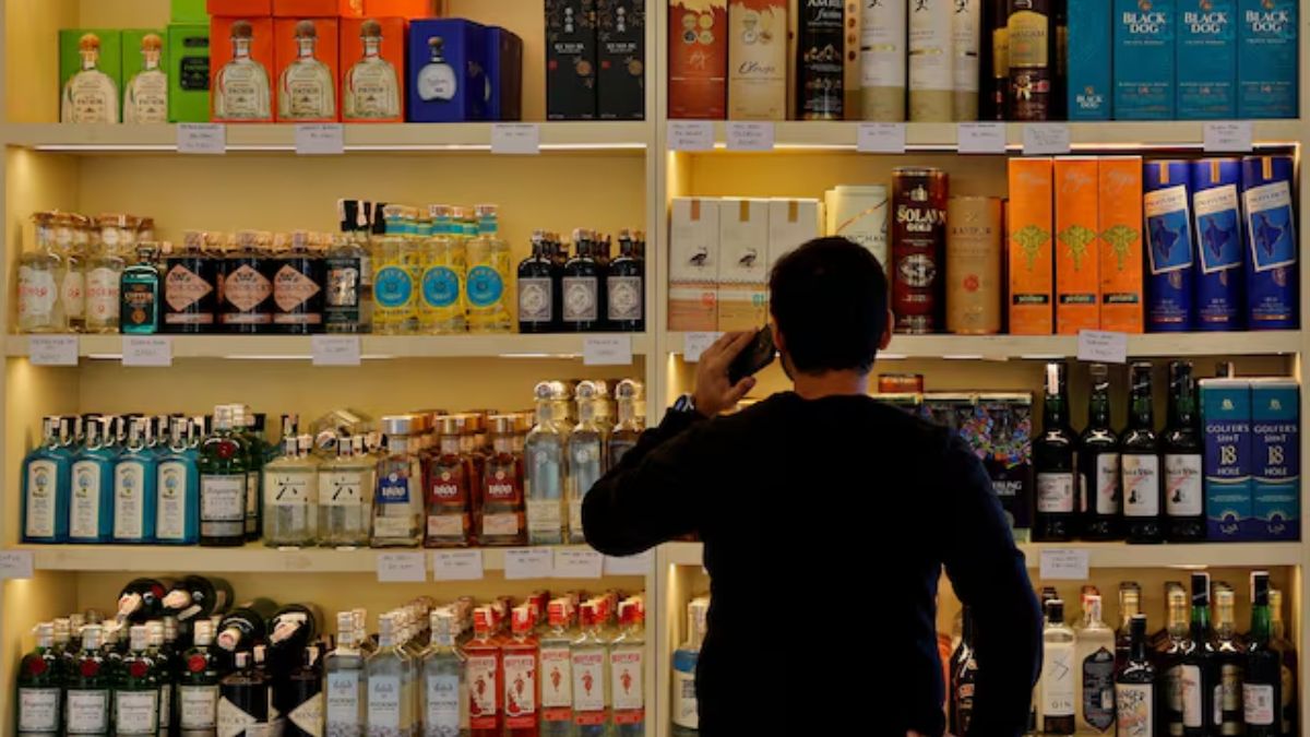 A customer looks at liquor bottles for purchase at a liquor store in Gurugram, India, on December 11, 2023. (Representational Image, Credit: Sahiba Chawdhary/Reuters) A customer looks at liquor bottles for purchase at a liquor store in Gurugram, India, on December 11, 2023. (Representational Image, Credit: Sahiba Chawdhary/Reuters)